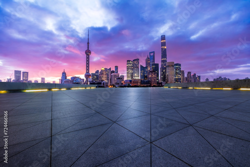 Empty square floor with modern city buildings scenery at night in Shanghai © ABCDstock