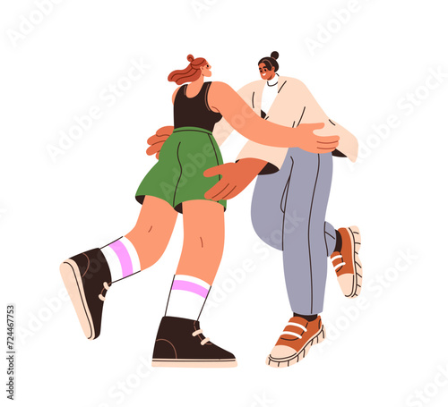 Happy girls friends meeting, hugging. Excited women smiling, greeting each ot...