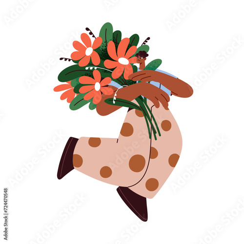 Girl with flower bouquet in hands. Happy black woman holding big gorgeous flo...