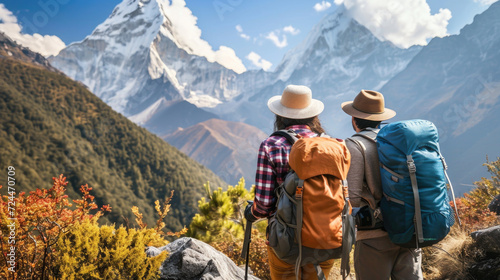 Couple Standing on Mountain Summit