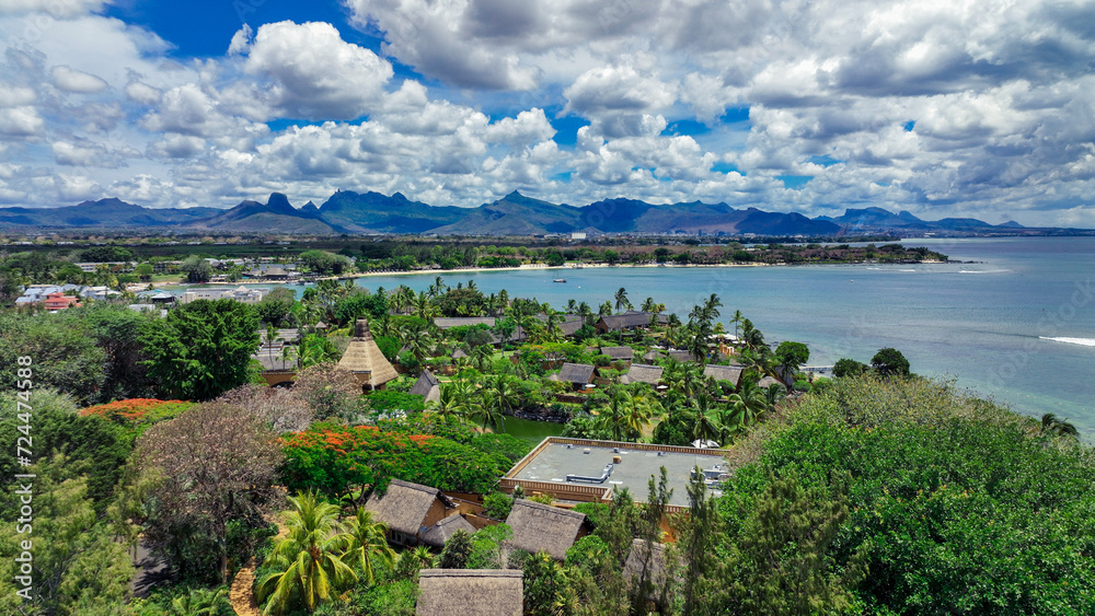 Aerial View of Tropical Island With Mountains in the Background