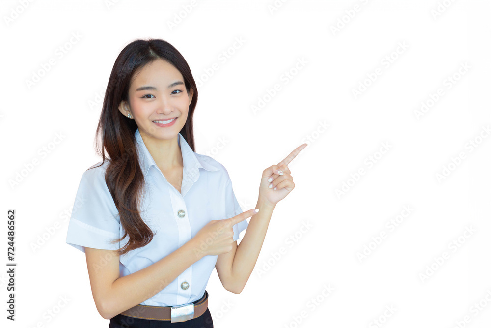 Portrait of adult Thai student. Beautiful Asian young woman student in uniform is smiling to present something confidently while isolated white background in the university Portrait of adult Thai student. Beautiful Asian young woman student in uniform is smiling to present something confidently while isolated white background in the university