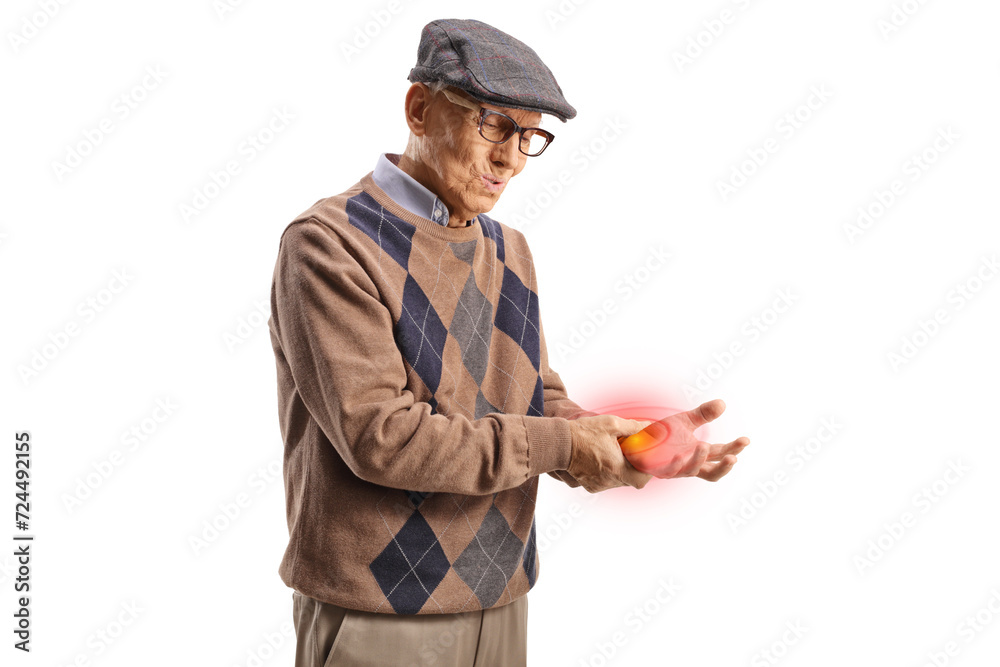 Elderly man in pain holding his inflamed wrist Elderly man in pain holding his inflamed wrist