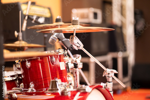 Complete set of red drums in studio, bokeh light background