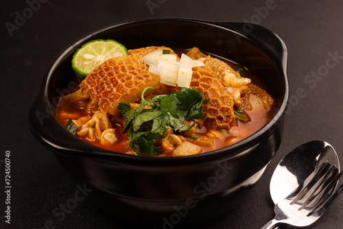 Menudo or Pancita is made of Beef Tripe that's been Simmered for Hours to Develop a Rich and Satisfying Broth. photo