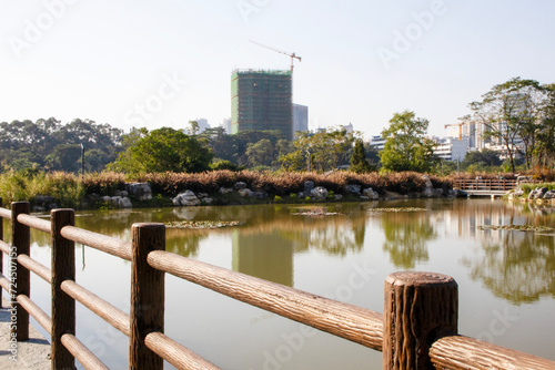 river, view of the park against the backdrop of the city, concrete wall, balusters, China photo