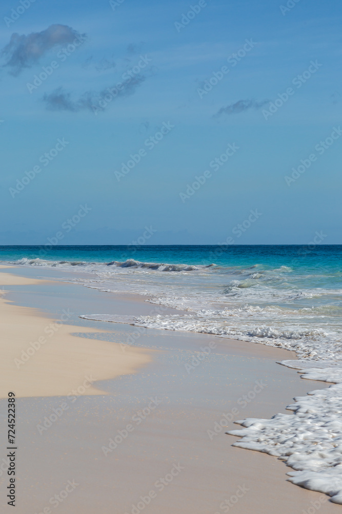 The idyllic Elbow Beach on the island of Bermuda, with a blue sky overhead