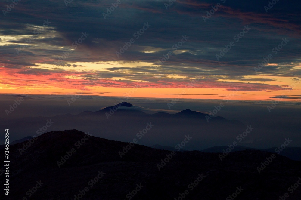 Sunrise and Mist Over Mountains