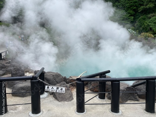 On May 29, 2023 at Jigoku Hell, Beppu City, Oita Province, Japan. A hot spring with bright blue water and hot smoke coming out of the pond.