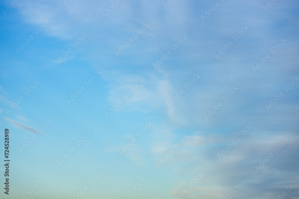 Obraz premium A beautiful sky tinted by the sun leaving vibrant shades of gold, pink, blue and multicolored. Clouds in the twilight evening and morning sky. Cloudy sky background in the evening and during the day.