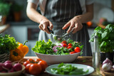Person preparing a nutritious salad with fresh ingredients in a modern, well-lit kitchen. Selective focus.