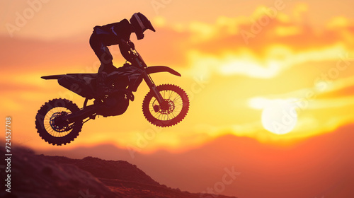 Blurred silhouette of motocross rider