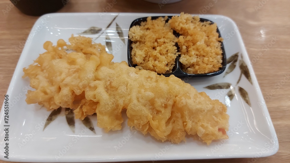 Shrimp tempura served on a plate. Tempura is a Japanese food. It is Japanese fried shrimp. Shrimp tempura served on a plate. Tempura is a Japanese food. It is Japanese fried shrimp.