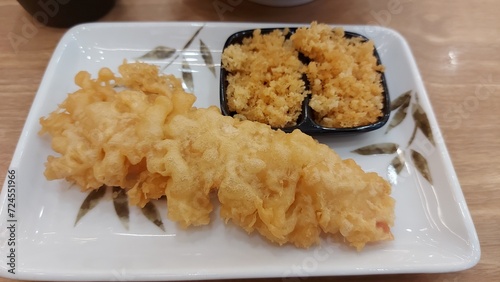 Shrimp tempura served on a plate. Tempura is a Japanese food. It is Japanese fried shrimp.