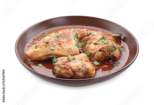 Tasty cooked rabbit meat with sauce and parsley isolated on white