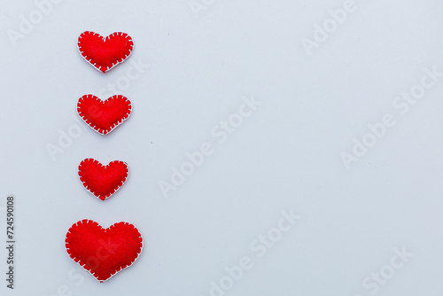 Foto Red felt diy homemade hearts couple isolated on white background