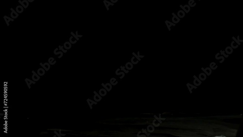 Human hands throwing a laptop falling on the hard floor and smashing into pieces scattered in space, locked down shot. Modern lifestyle, stress, and anxiety concepts.