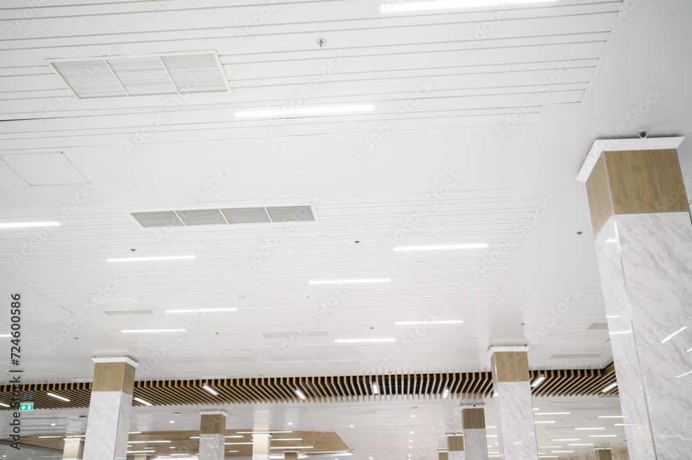 Ceiling mounted cassette type air conditioner and modern lamp light on ...