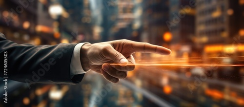 blurred background, Close up of hand pointing at screen with finger. Businessman concept