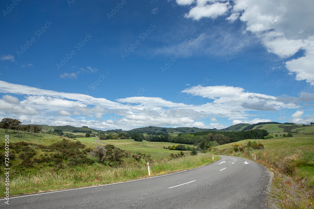 Country road near Carterton. New Zealand. Rural. Meadows and hills. Spring. Typical New Zealand landscape.