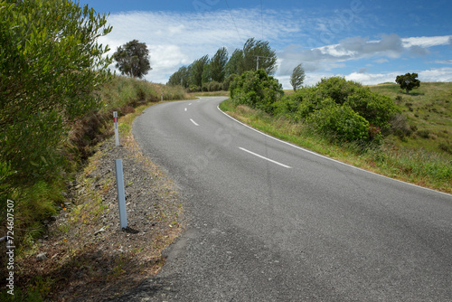 Country road near Carterton. New Zealand. Rural. Meadows and hills. Spring. Typical New Zealand landscape.