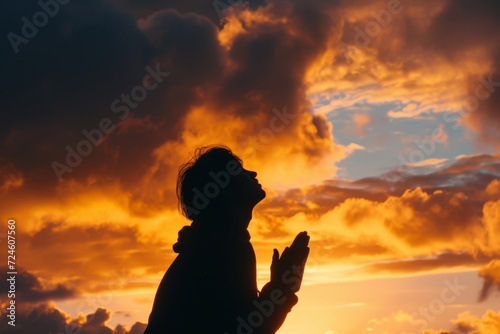 positioned as if in prayer beautiful sunset