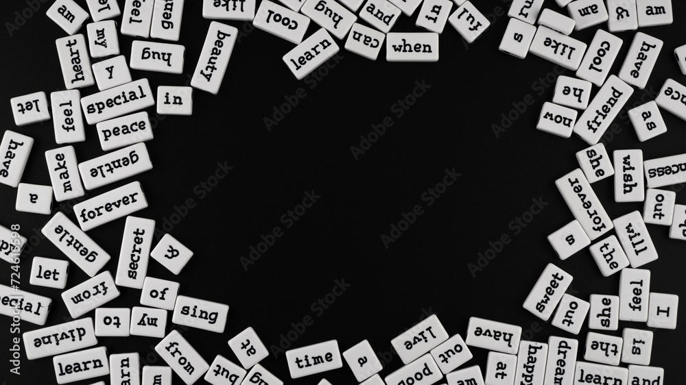 Black and white composition. Words in English on rectangular small plastic blocks of white colour. In the centre is an empty space. Series of words in minimalist style. Black background. Black and white composition. Words in English on rectangular small plastic blocks of white colour. In the centre is an empty space. Series of words in minimalist style. Black background.