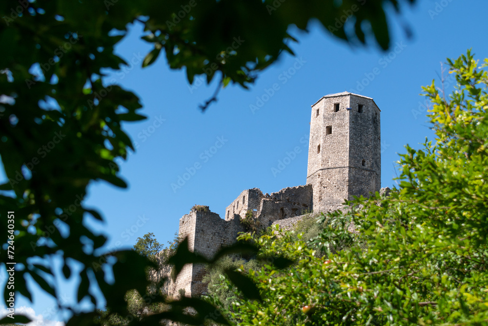 Gavran-Kapetanovic tower in medieval town Počitelj against blue sky