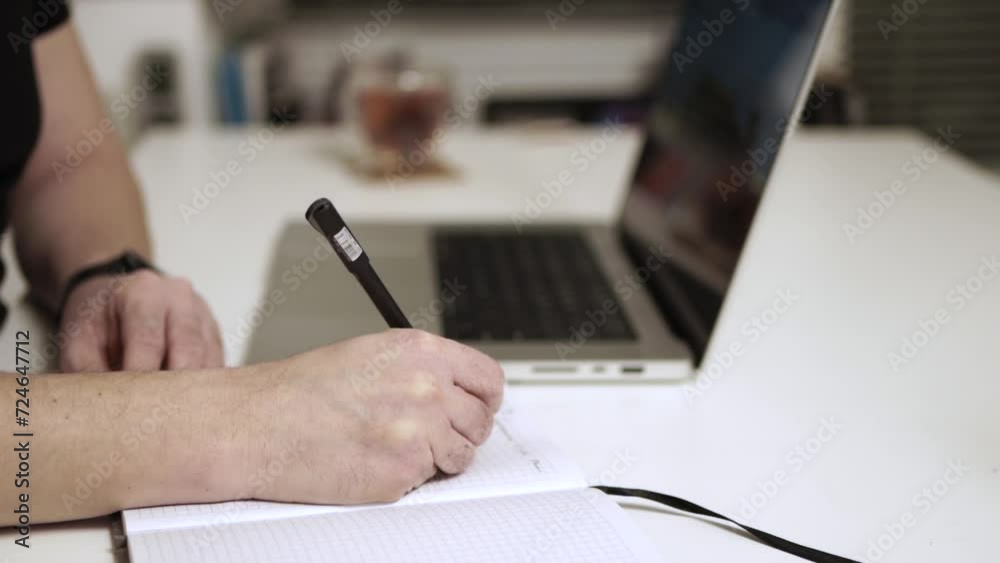 Man working on laptop on the table Man working on laptop on the table