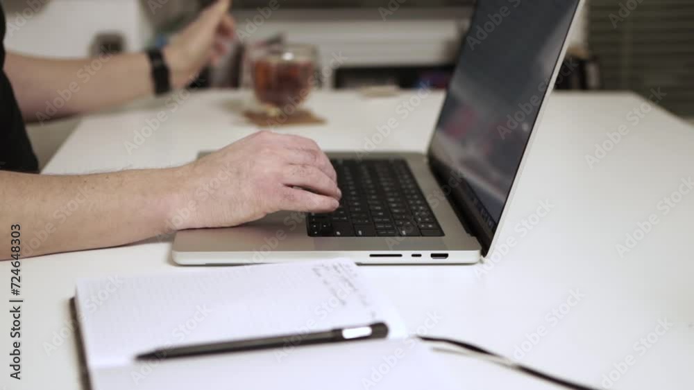 Man working on laptop on the table Man working on laptop on the table