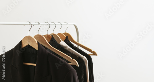 Fotografie Modern rack with capsule collection in neutral black and beige colours