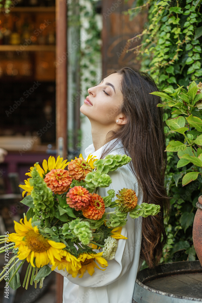 Content Woman with a Bouquet of Seasonal Flowers Content Woman with a Bouquet of Seasonal Flowers