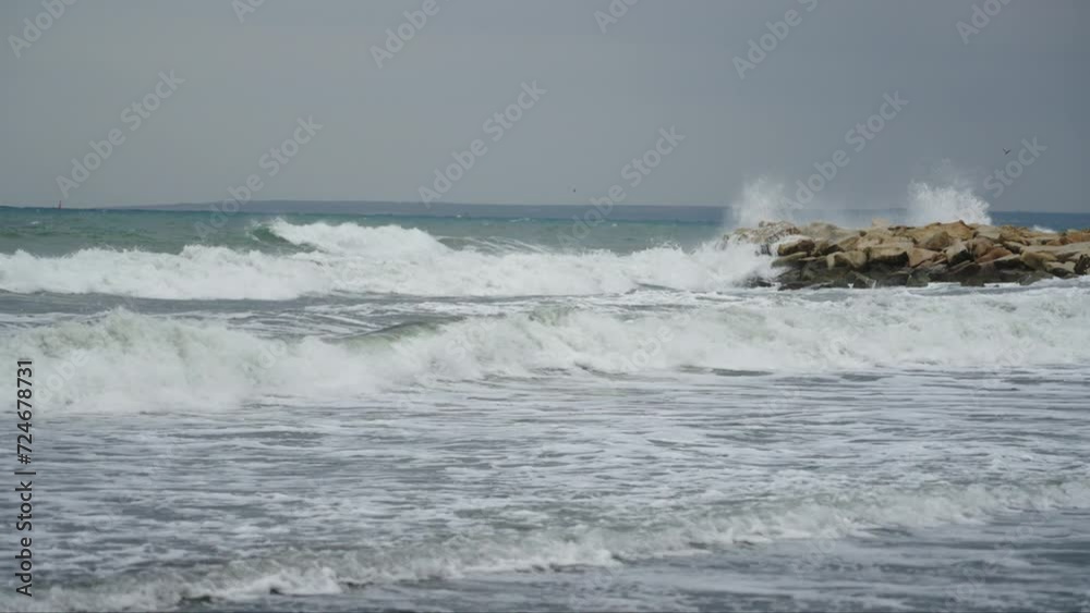Big waves of Mediterranean sea crashing on stone beach. Big waves of Mediterranean sea crashing on stone beach.