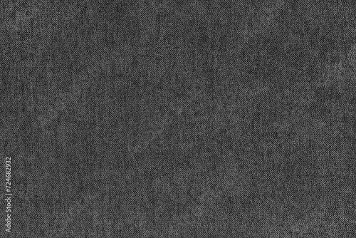 Texture background of velours jacquard black fabric. Upholstery texture fabric, velvet furniture textile material, design interior, decor. Fleecy fabric texture close up, backdrop, wallpaper.