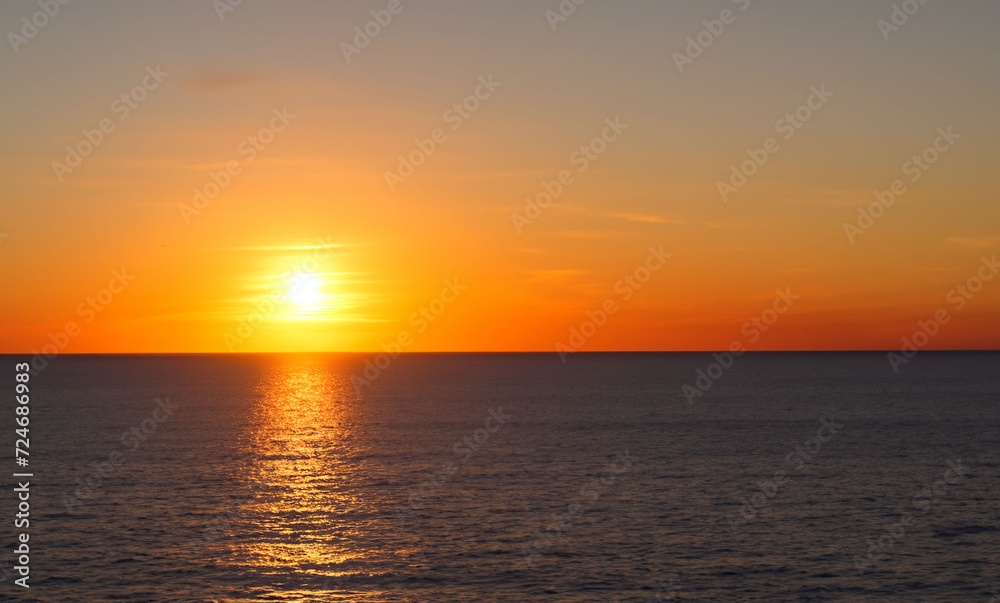 a beautiful sunset at sea on the island of Aruba generated with artificial intelligence
