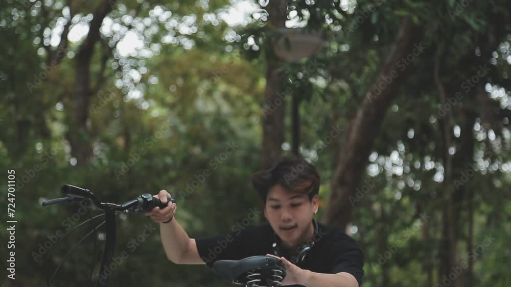 custom made wallpaper toronto digitalHealthy and active lifestyle, going to work on eco transport. Smiling attractive millennial male employee in glasses with bag and cup of takeaway coffee, moving bike in city park in summer, outdoor