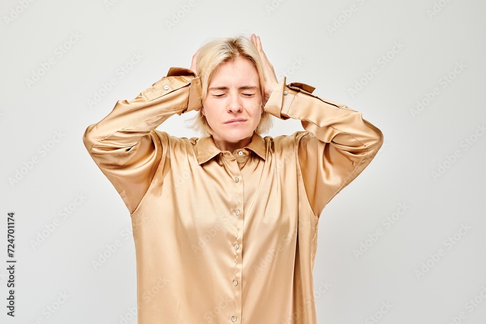 Portrait of tired girl with sad face feeling emotional burnout on white background. Nerves, stress, uncertainty concept. Portrait of tired girl with sad face feeling emotional burnout on white background. Nerves, stress, uncertainty concept.