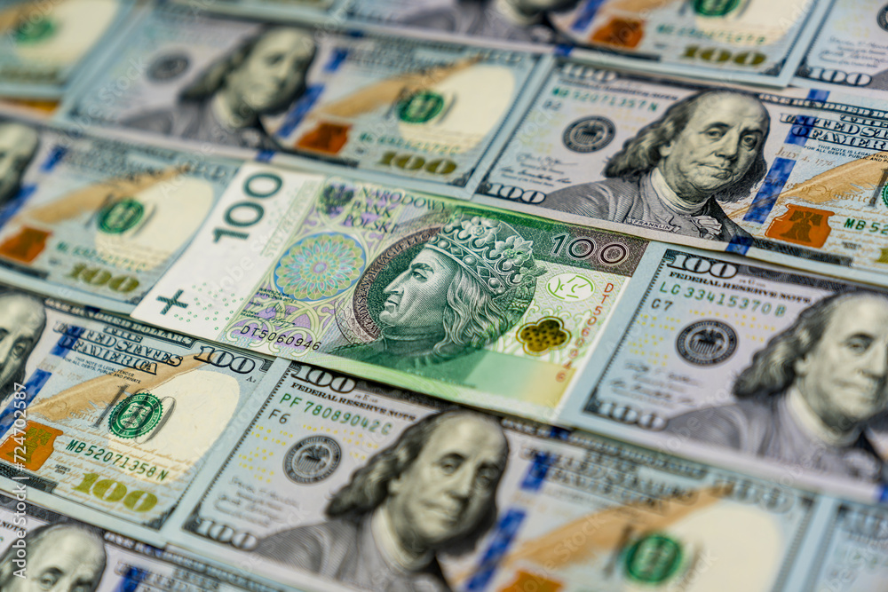 A 100 zl Polish banknote surrounded with 100 USD banknotes A 100 zl Polish banknote surrounded with 100 USD banknotes