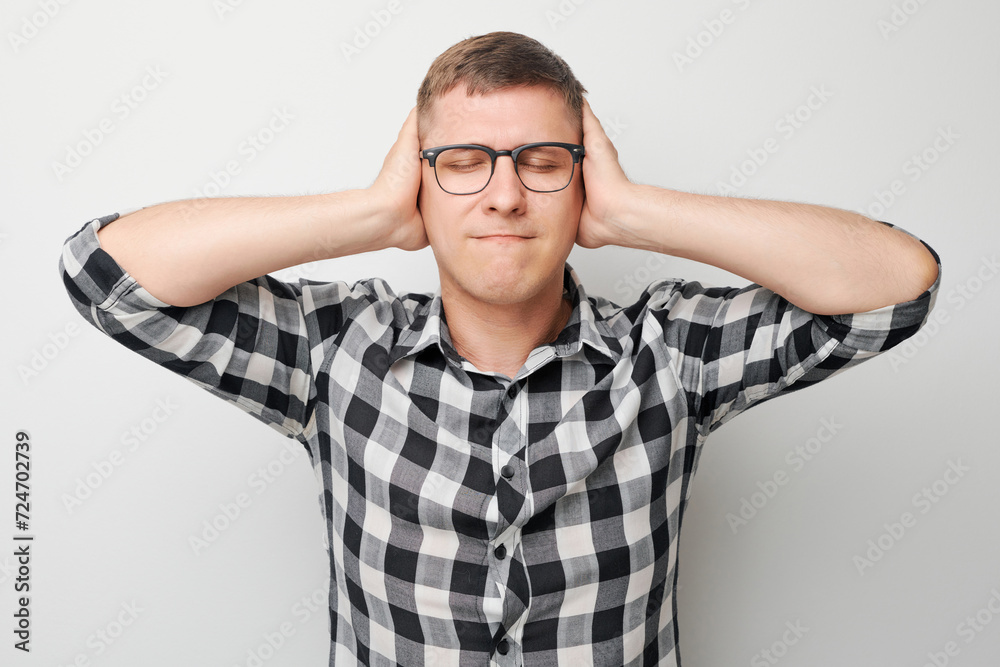 Portrait of tired guy with sad face feeling emotional burnout on white background. Nerves, stress, uncertainty concept. Portrait of tired guy with sad face feeling emotional burnout on white background. Nerves, stress, uncertainty concept.