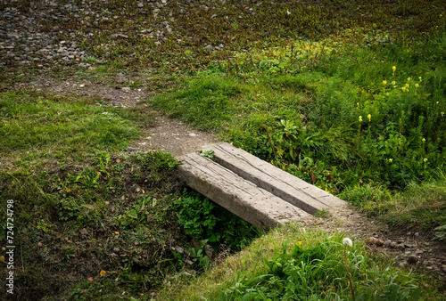 Wooden bridge over ravine. Seasonal hiking.