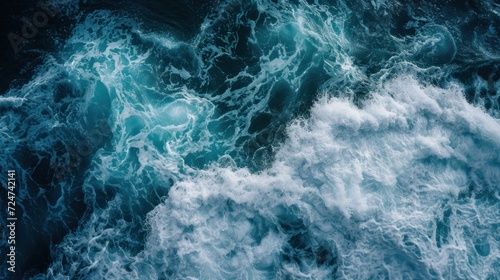 Aerial view of deep blue sea with frothy waves