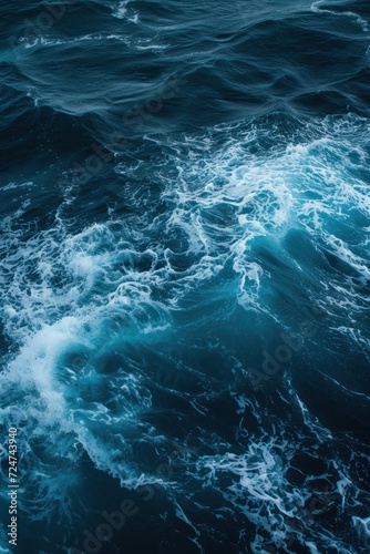 Aerial view of deep blue sea with frothy waves © Oksana