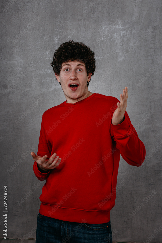 custom made wallpaper toronto digitalportrait of a surprised young man on a background and looking to the camera