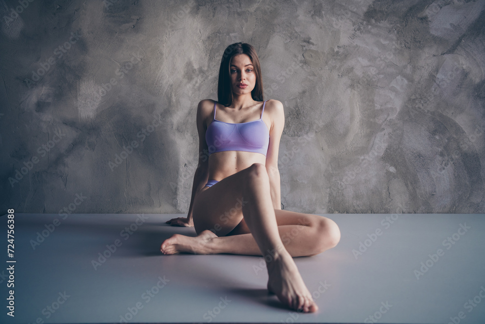 Full body size photo of perfect elegant lady seducing you with her new pedicure isolated on grey wall background Full body size photo of perfect elegant lady seducing you with her new pedicure isolated on grey wall background