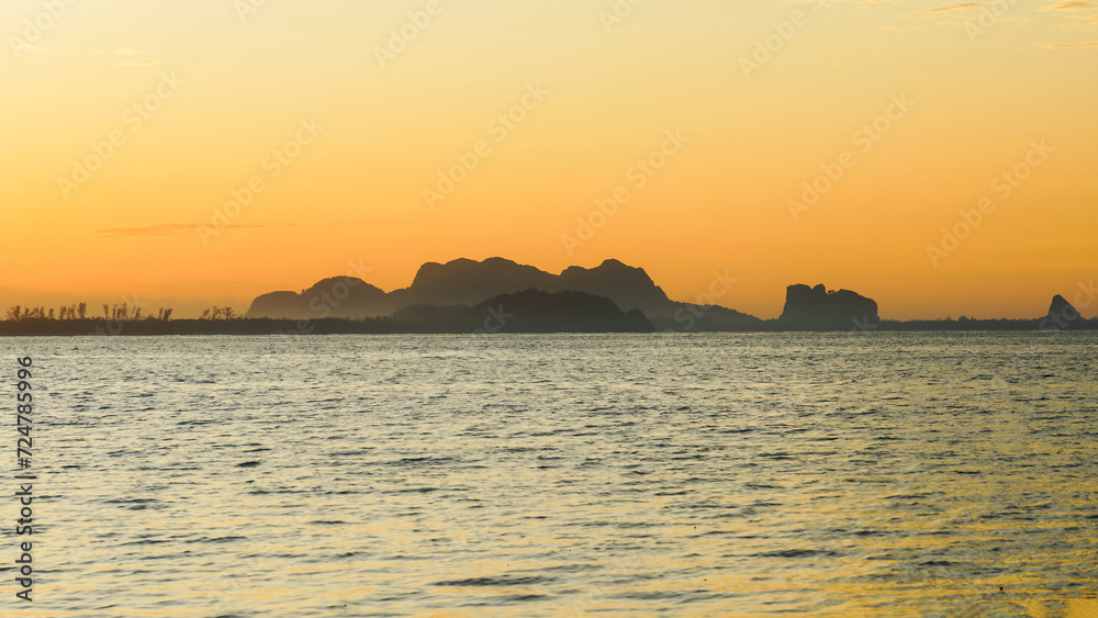The sea with twilight sky in morning at koh mook, Trang province, Thailand. Tropical sunset or sunrise Landscape light by the sea.