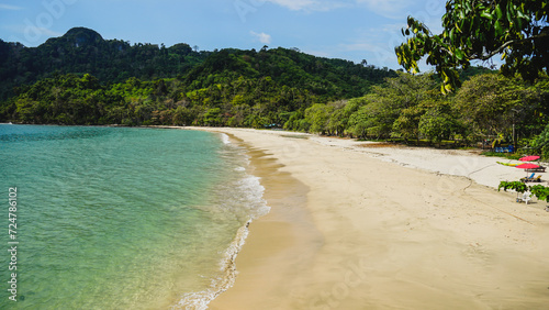 Beautiful Tropical beach at Koh Mook (Koh Muk) island, Thailand. Hotel and tropical beach with palm trees and soft white sand, and a turquoise colored ocean.