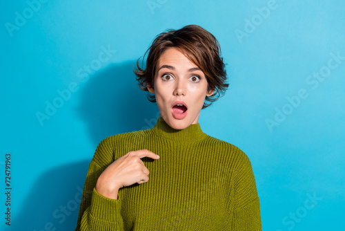 Photo of shocked impressed girl open mouth wear stylish green clothes arm showing herself isolated on cyan color background