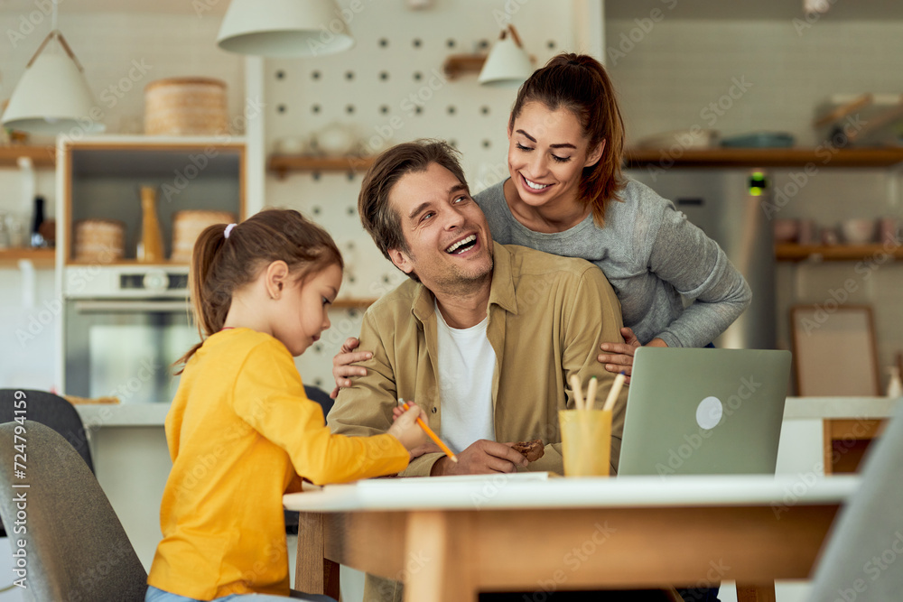A lovely family having fun together in the comfort of their own home. A lovely family having fun together in the comfort of their own home.