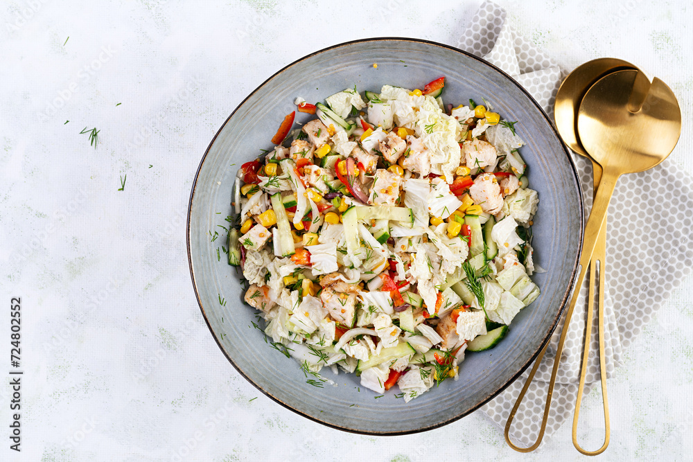 Chinese cabbage salad with chicken meat, corn, cucumber and dressing mustard. Asian food. Top view Chinese cabbage salad with chicken meat, corn, cucumber and dressing mustard. Asian food. Top view