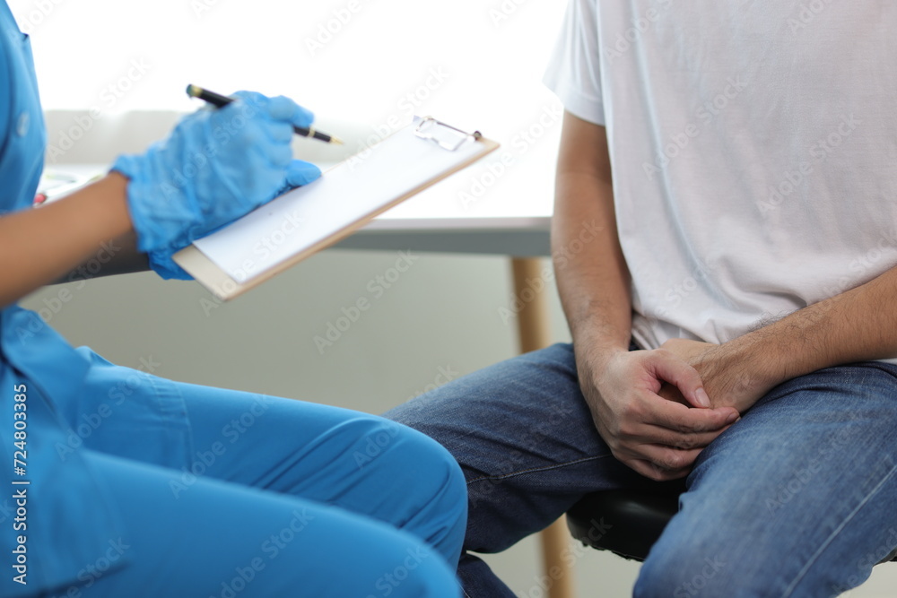 Doctor is diagnosing male erectile dysfunction and giving treatment recommendations, male health problems. Doctor is diagnosing male erectile dysfunction and giving treatment recommendations, male health problems.